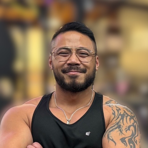 Glenn Pineda, smiling with his arms crossed at Potrero Hill